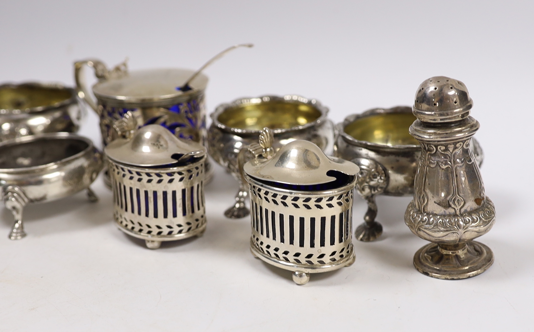 Eleven assorted antique and later silver bun salts, pepperettes and mustard pots including Victorian drum mustard, London, 1853.